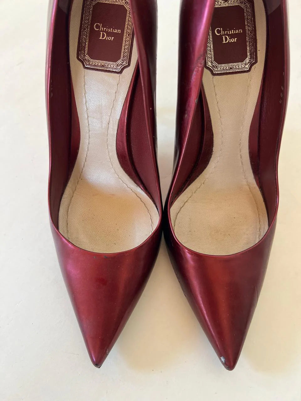 Dior metallic burgundy wedge pumps
