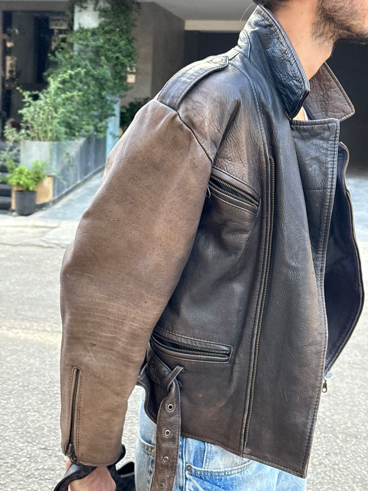 Distressed vintage brown leather jacket